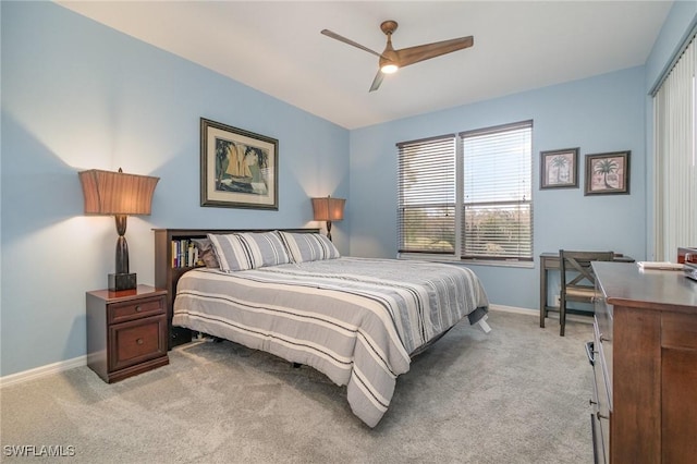 bedroom with ceiling fan and light colored carpet