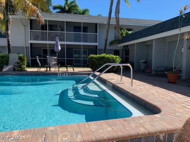 view of swimming pool with a patio area