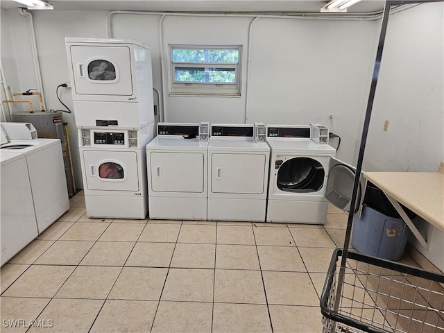 laundry room with stacked washing maching and dryer, separate washer and dryer, and light tile patterned floors