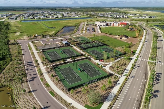 birds eye view of property with a water view