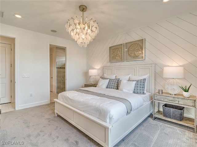 carpeted bedroom with a notable chandelier and wood walls