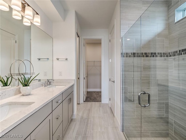 bathroom with an enclosed shower and vanity