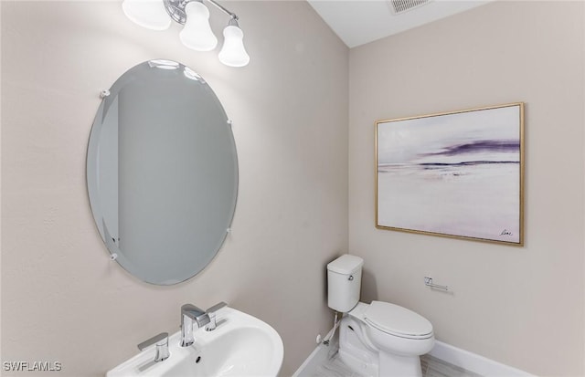 bathroom with sink and toilet