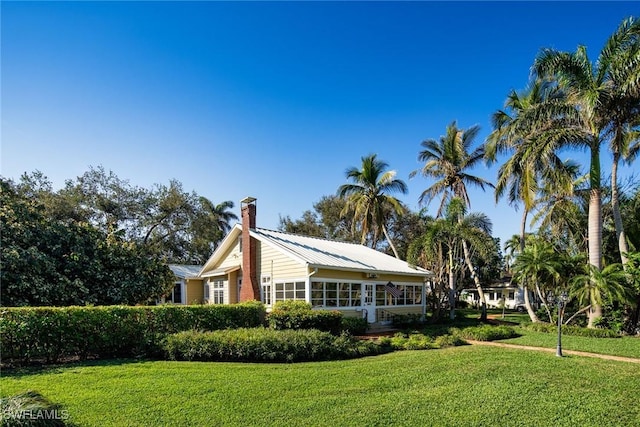 view of property exterior featuring a lawn