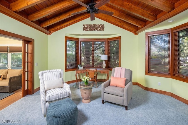 sitting room featuring carpet floors, ceiling fan, lofted ceiling with beams, and wood ceiling