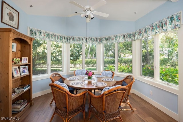 sunroom / solarium featuring lofted ceiling and ceiling fan