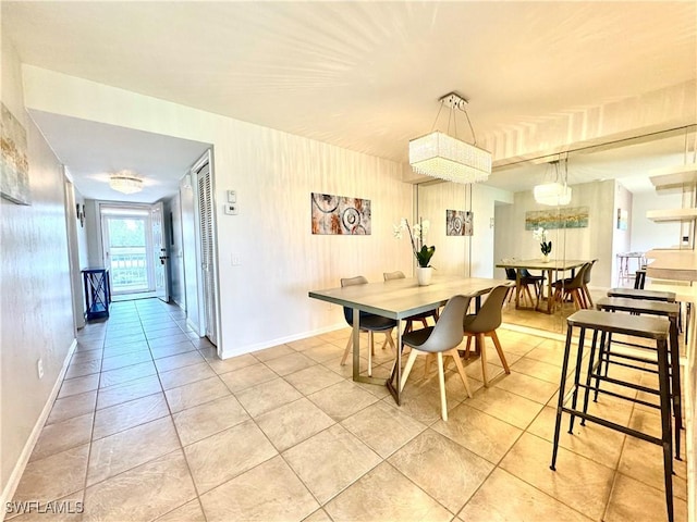 dining room with light tile patterned flooring