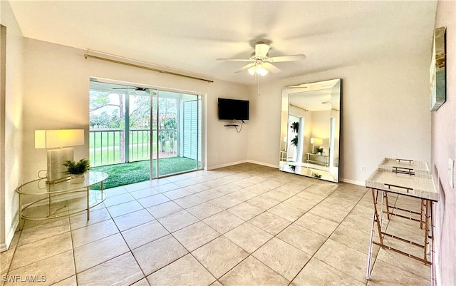 interior space featuring light tile patterned flooring and ceiling fan