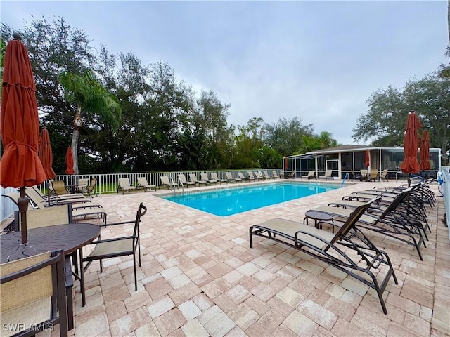 view of swimming pool featuring a patio area