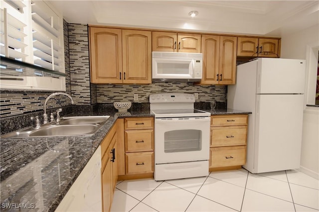 kitchen featuring sink, white appliances, light tile patterned floors, and light brown cabinets