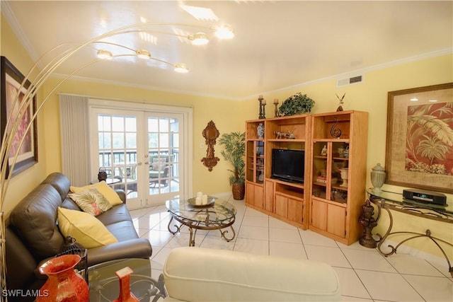 living room with ornamental molding, light tile patterned floors, and french doors