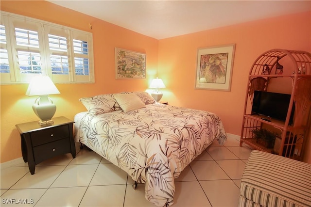 bedroom featuring light tile patterned floors