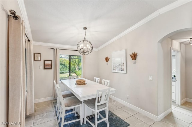 dining room with an inviting chandelier, ornamental molding, and light tile patterned flooring