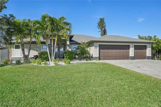 ranch-style home with a garage and a front yard