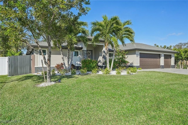 view of front of property featuring a garage and a front yard