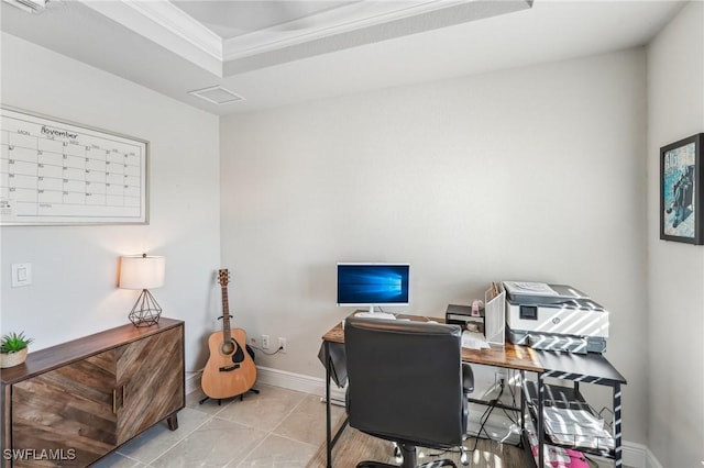 office with light tile patterned flooring, crown molding, and a tray ceiling