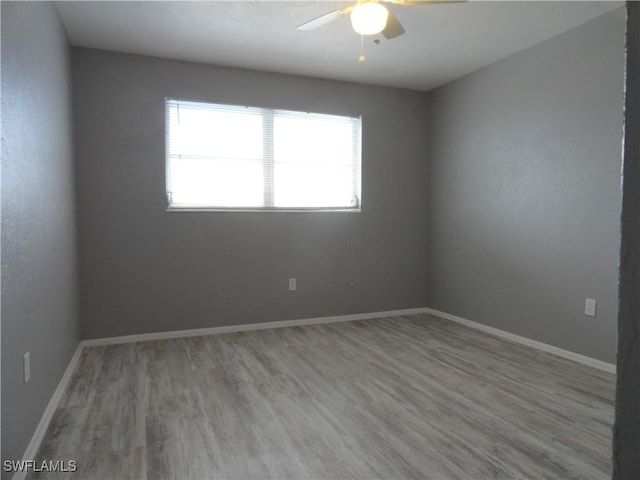 spare room with ceiling fan and light hardwood / wood-style flooring