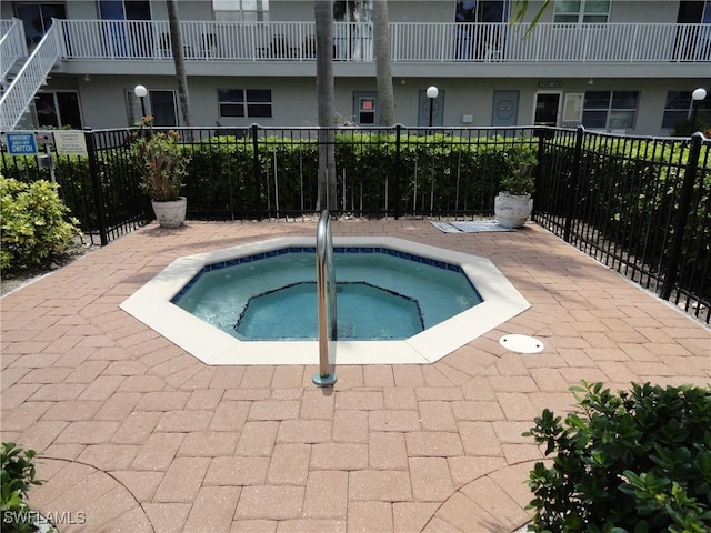 view of pool featuring a hot tub