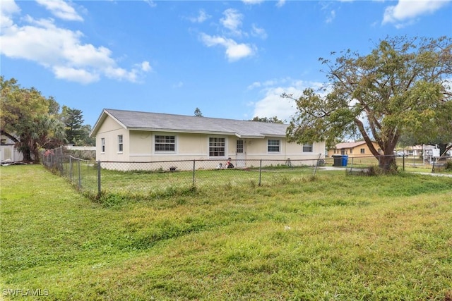 6135 Markland Ave, Fort Myers, FL 33916 - back of property with a fenced backyard and a lawn