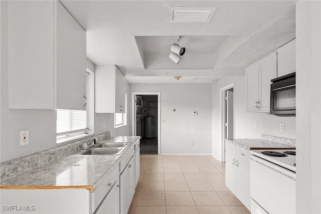 6135 Markland Ave, Fort Myers, FL 33916 - kitchen with black microwave, a tray ceiling, visible vents, white range with electric stovetop, and a sink