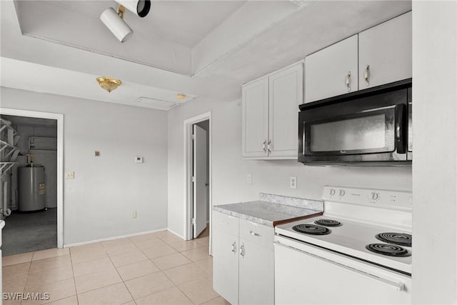 6135 Markland Ave, Fort Myers, FL 33916 - kitchen featuring light tile patterned floors, black microwave, white cabinets, water heater, and white range with electric stovetop