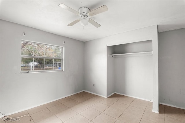 6135 Markland Ave, Fort Myers, FL 33916 - unfurnished bedroom with a closet, tile patterned floors, a ceiling fan, and baseboards