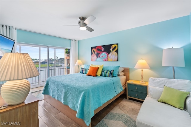 bedroom featuring hardwood / wood-style flooring, access to outside, and ceiling fan