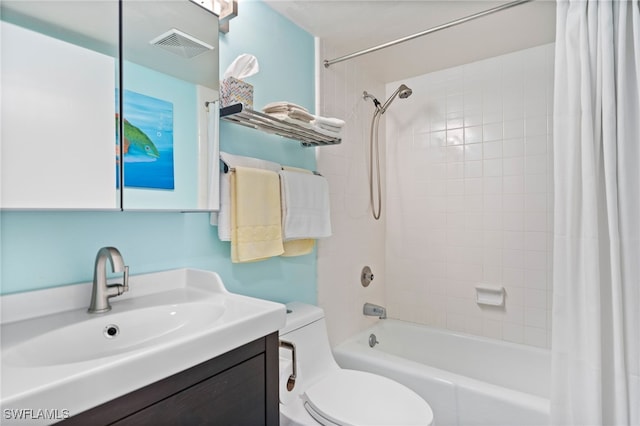 full bathroom featuring shower / tub combo with curtain, vanity, and toilet