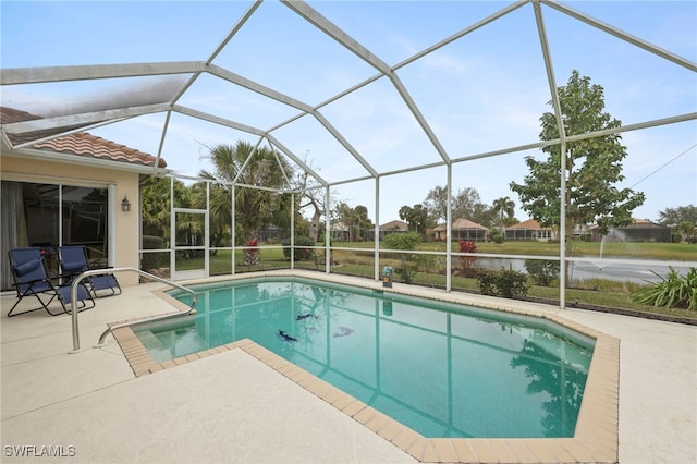 view of pool featuring glass enclosure and a patio