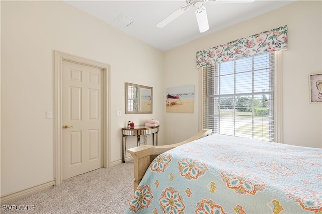 bedroom with light colored carpet and ceiling fan