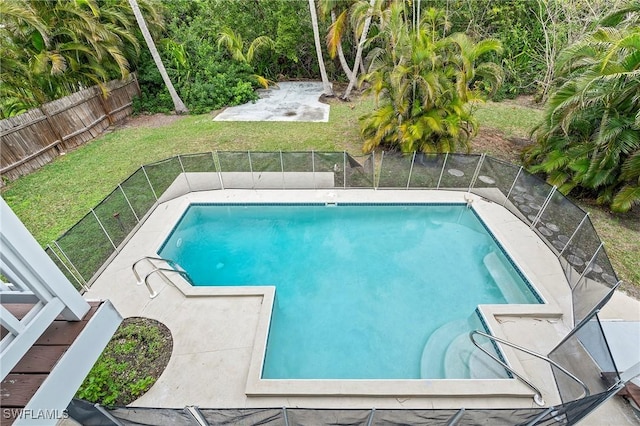 view of pool featuring a yard