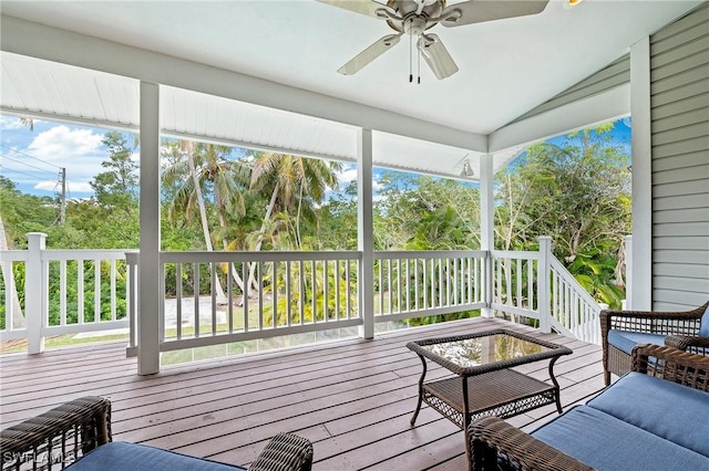 sunroom featuring plenty of natural light, ceiling fan, and vaulted ceiling