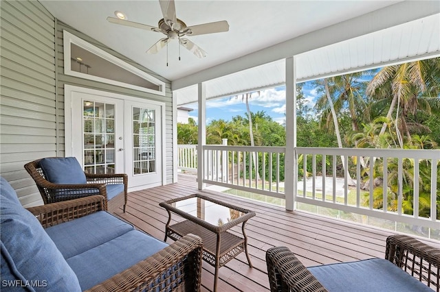 sunroom with vaulted ceiling, plenty of natural light, ceiling fan, and french doors