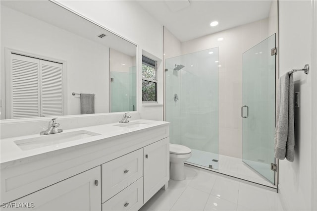 bathroom with walk in shower, vanity, toilet, and tile patterned flooring