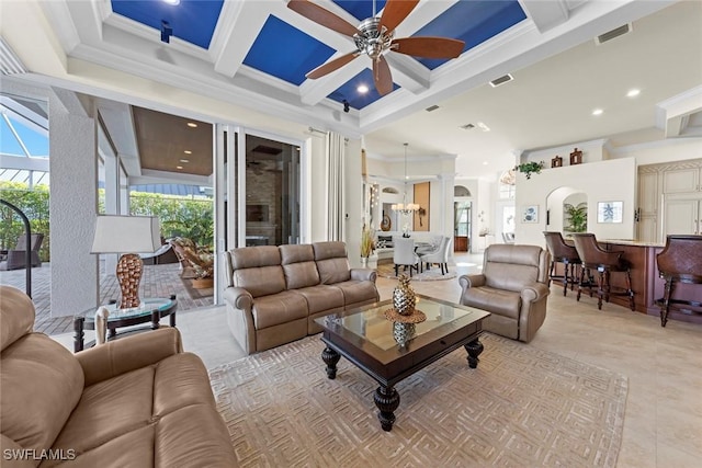 living room with coffered ceiling, beamed ceiling, ornamental molding, and a healthy amount of sunlight