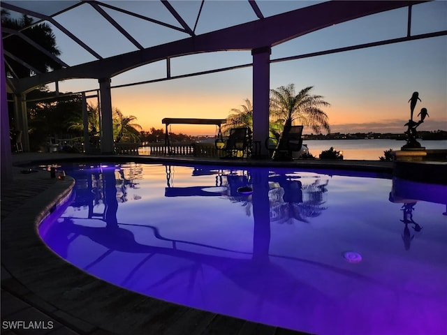 pool at dusk with a water view