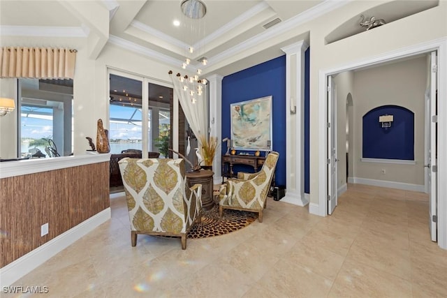 living area with crown molding, wooden walls, and decorative columns