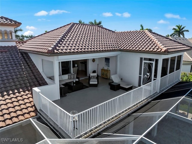 back of property featuring outdoor lounge area