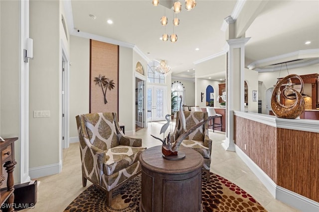 reception featuring an inviting chandelier, decorative columns, and french doors