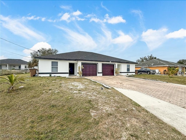 view of front of house featuring a garage and a front yard