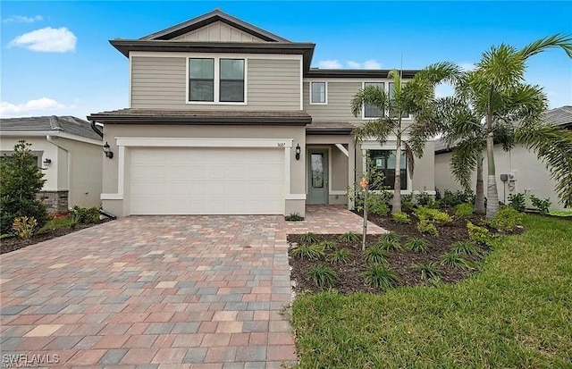 view of front of property with a garage