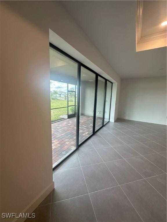 spare room with tile patterned floors