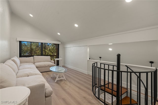 living room featuring light hardwood / wood-style flooring and high vaulted ceiling