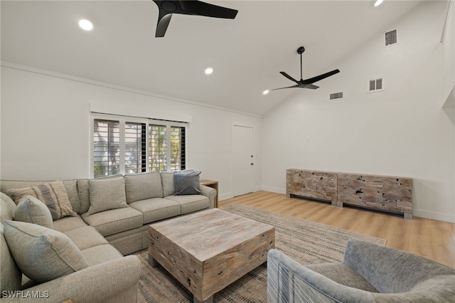 living room featuring high vaulted ceiling, ceiling fan, and light hardwood / wood-style flooring