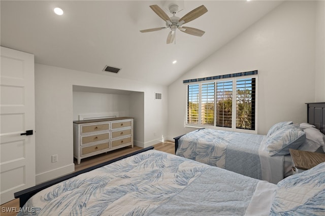 bedroom featuring high vaulted ceiling, dark hardwood / wood-style floors, and ceiling fan