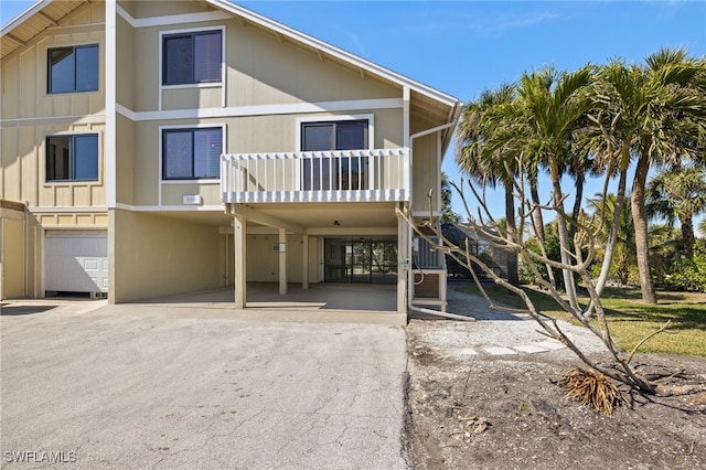 exterior space featuring a balcony and a garage