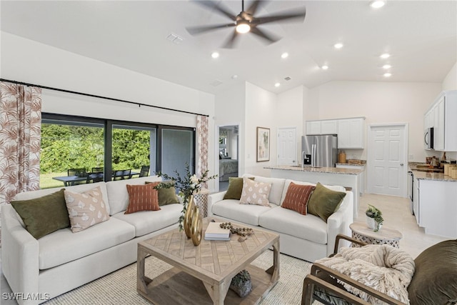 living room featuring ceiling fan and high vaulted ceiling