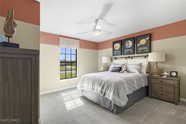 bedroom with light colored carpet and ceiling fan