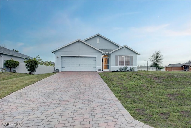 single story home with a garage and a front yard