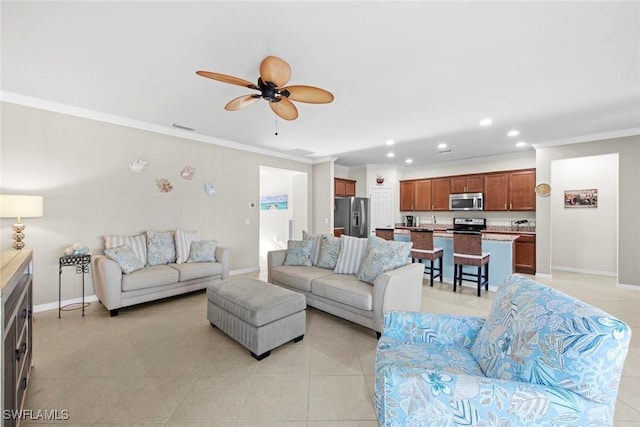 living area with light tile patterned floors, baseboards, crown molding, and recessed lighting